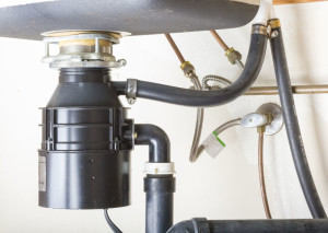 Garbage disposal under a kitchen sink