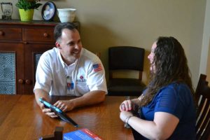 Larry and Sons Technician Talking with Customer