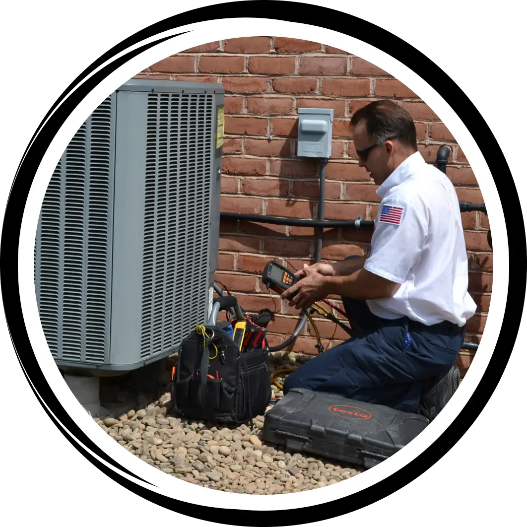 A technician working on an ac unit